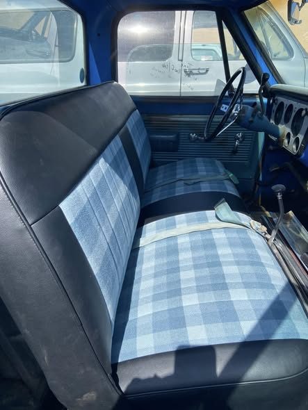 Blue and tan plaid bench seat in a classic truck