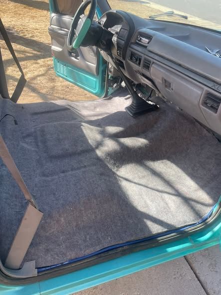 Replaced teal carpet and floor